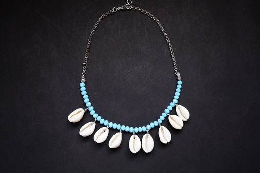 Full view of turquoise crystal beads & cowrie short necklace on a dark background – women fashion jewellery