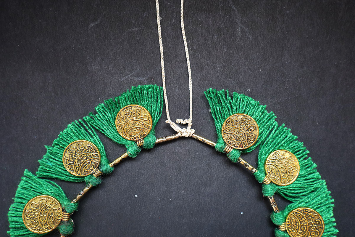Showing the knot structure of ginni and tassel moss green colored short necklace – fashion jewellery for women