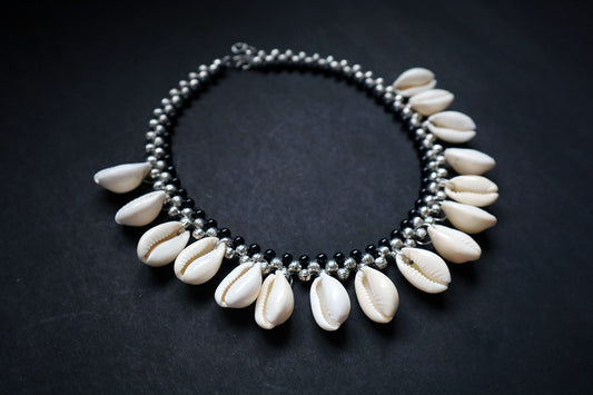 Perspective view of short metal beads and cowrie silver colored necklace – fashion jewellery for women
