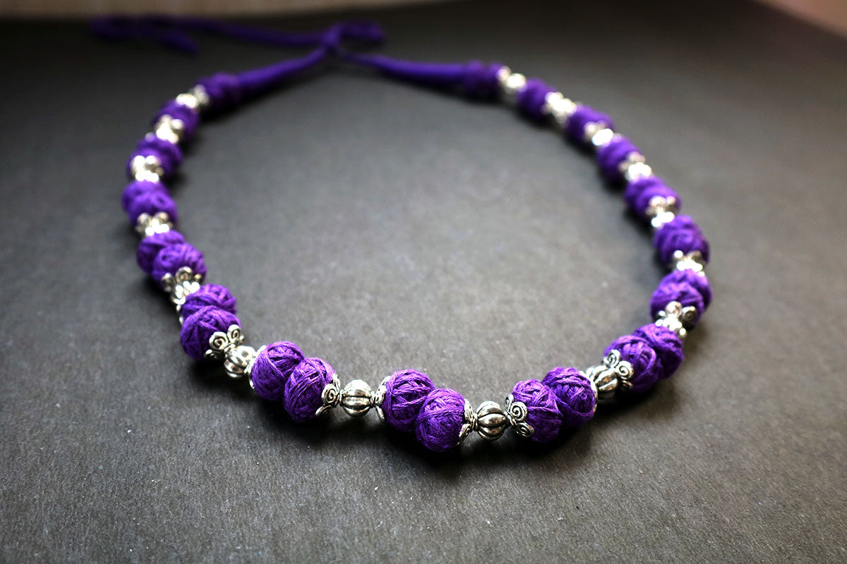Perspective view of oxidized and cotton balls violet long necklace – fashion jewellery for women