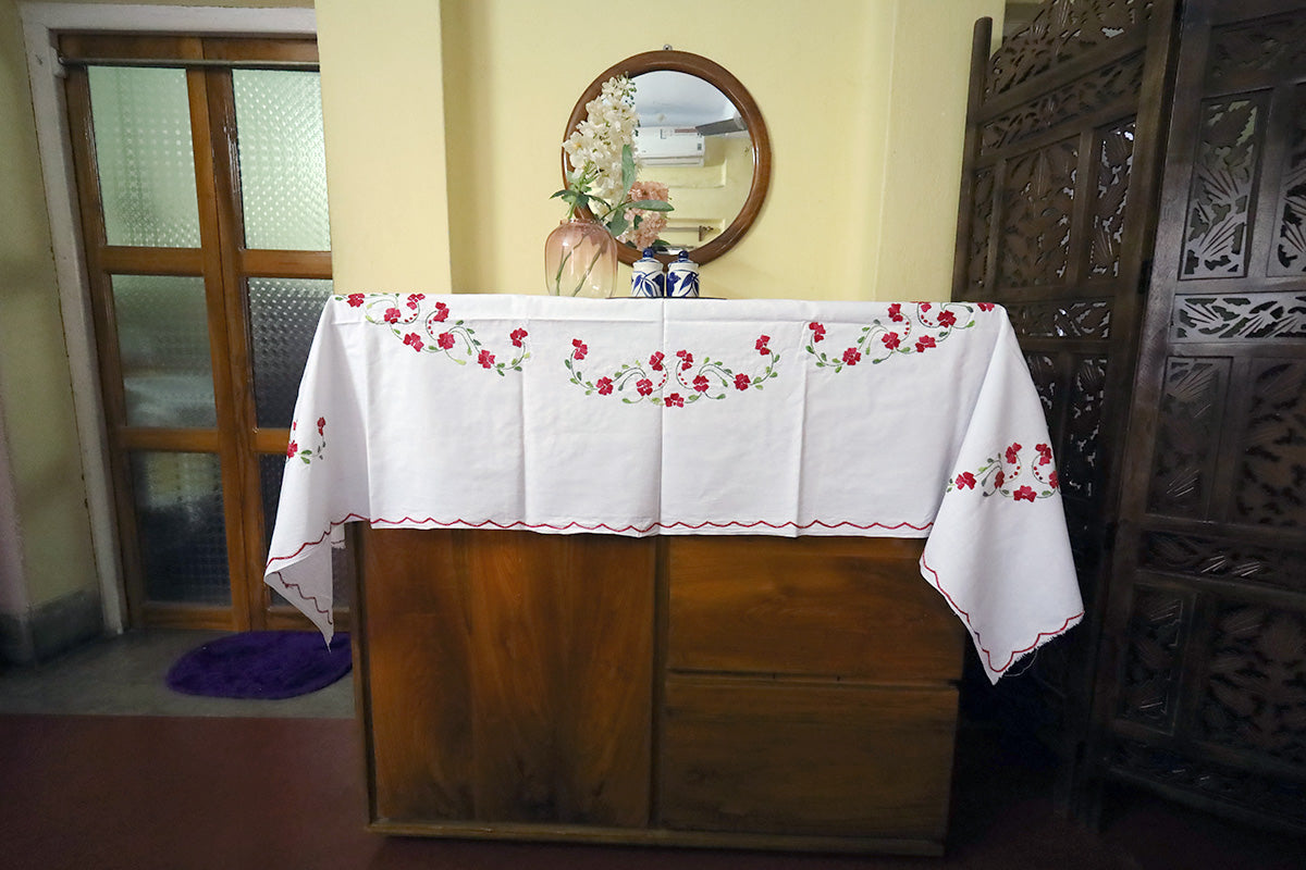 Full view of Crimson Red Hand Embroidery Table Cloth with a chest of drawers, showcasing its rich design and craftsmanship.