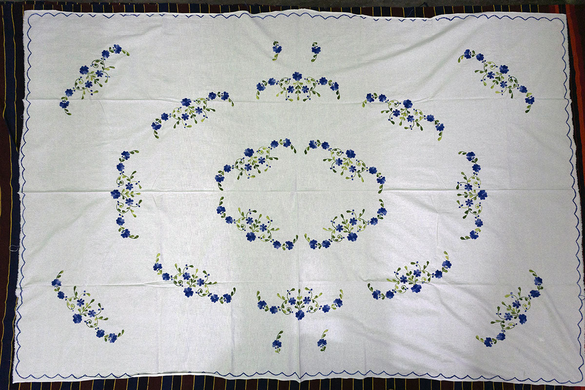 Complete top-angle view of Navy Blue Hand Embroidery Table Cloth styled on a chest of drawers for a modern touch.
