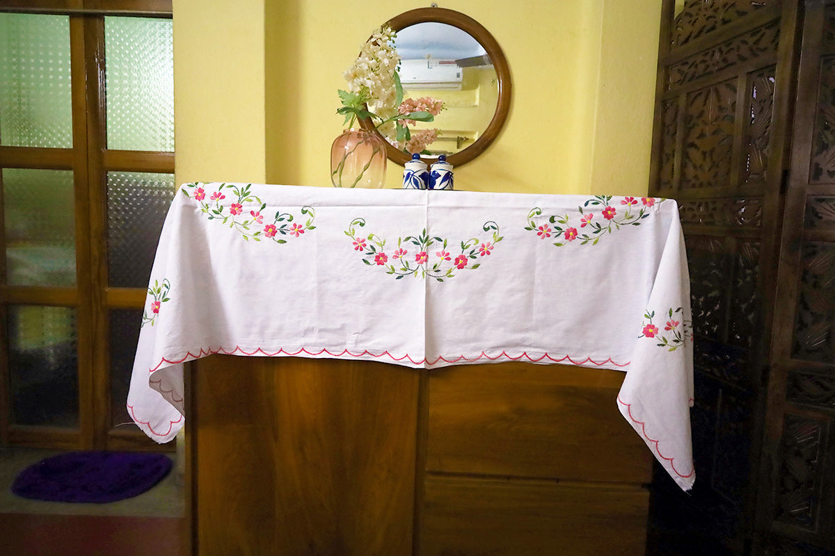 Full view of Pink Hand Embroidery Table Cloth styled with a chest of drawers, showcasing its soft and elegant design.