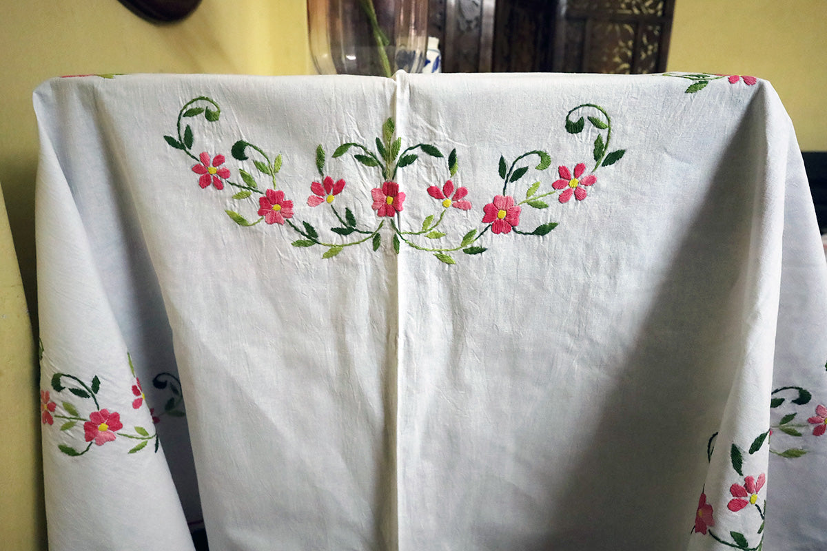 Side angle of Pink Hand Embroidery Table Cloth paired with a chest of drawers, highlighting its intricate craftsmanship.