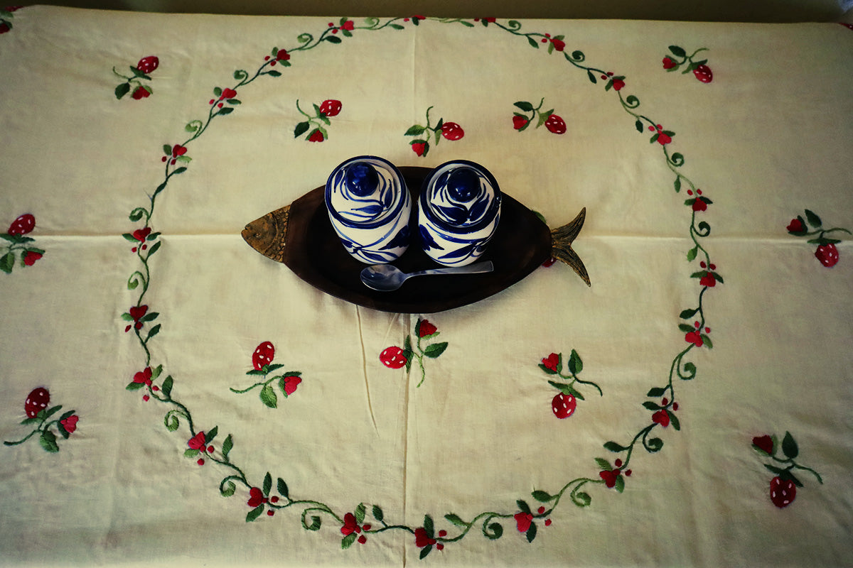 Top view of Wine Red Hand Embroidery Table Cloth featuring intricate patterns on a chest of drawers.
