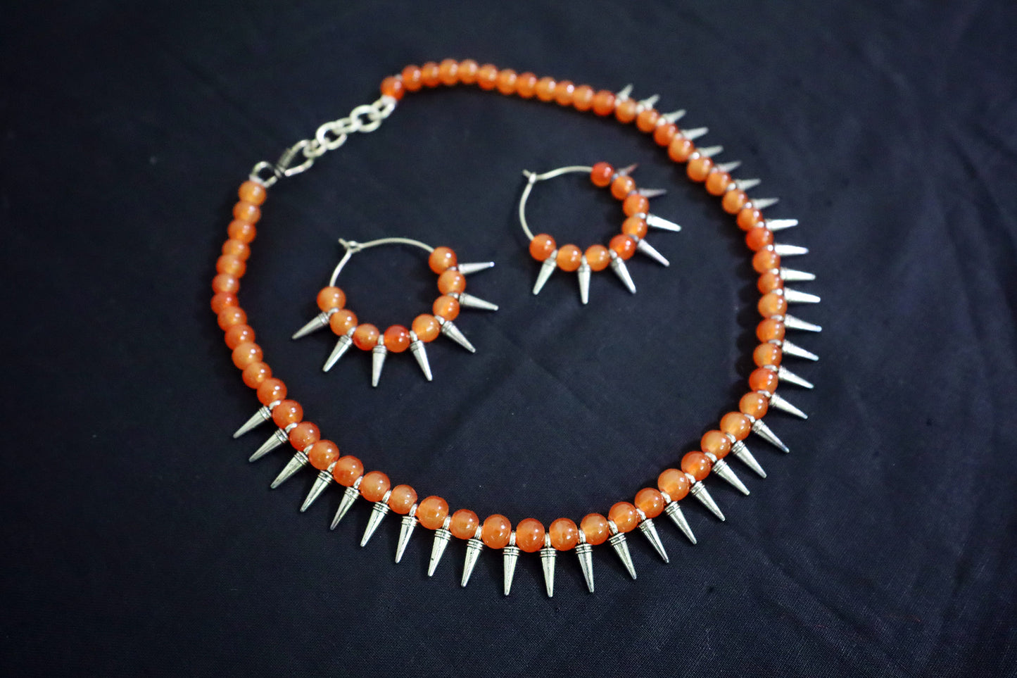 Angle view of Orange Glass Beads Oxidized Cone Necklace Set with earrings – handmade fashion jewellery