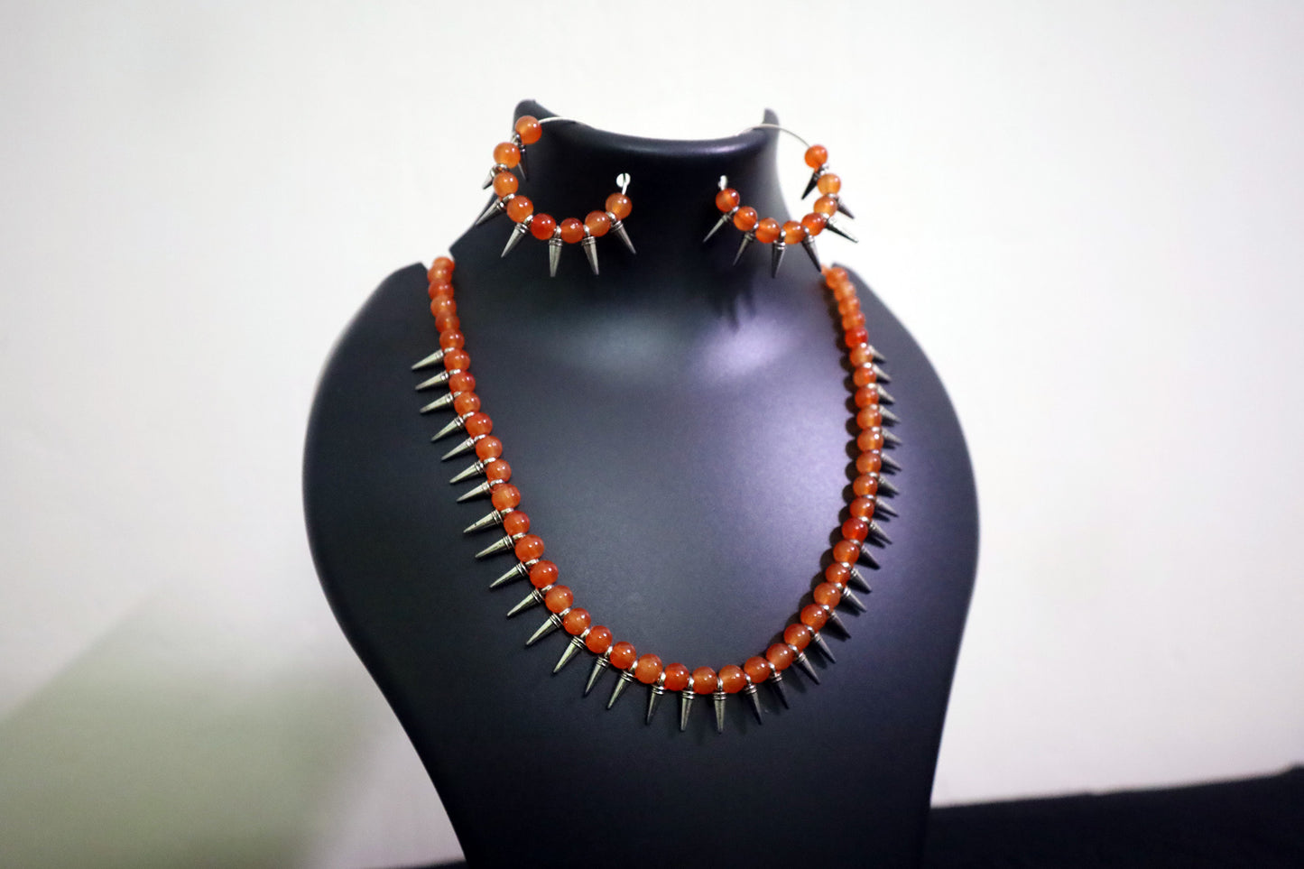 Closer view of Orange Glass Beads Oxidized Cone Necklace Set on mannequin – handmade fashion jewellery