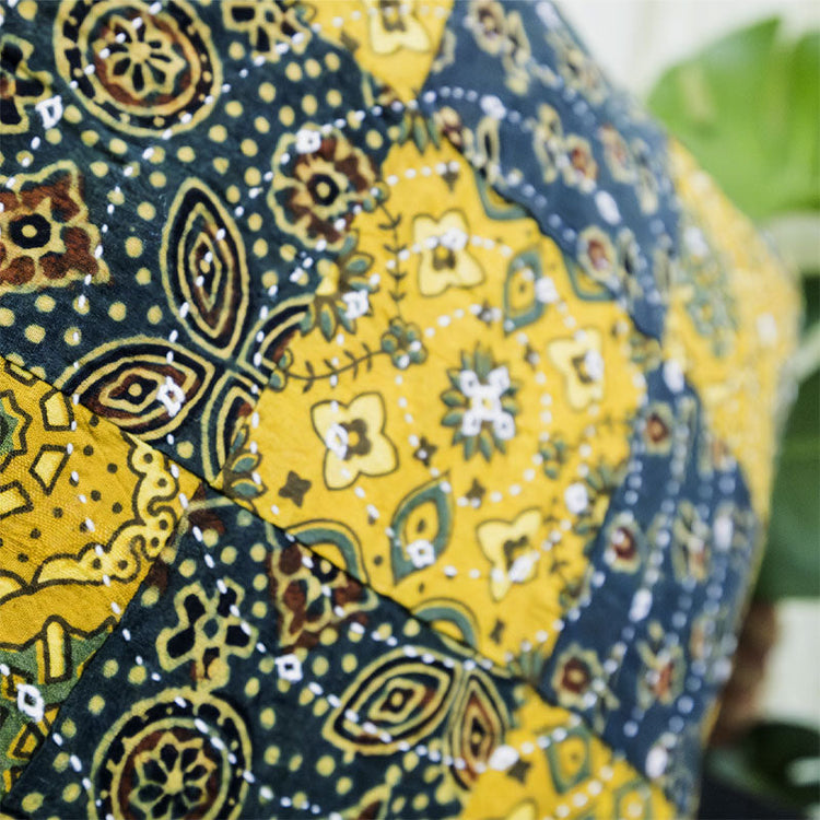 Handcrafted cushion covers in vibrant colors and intricate patterns