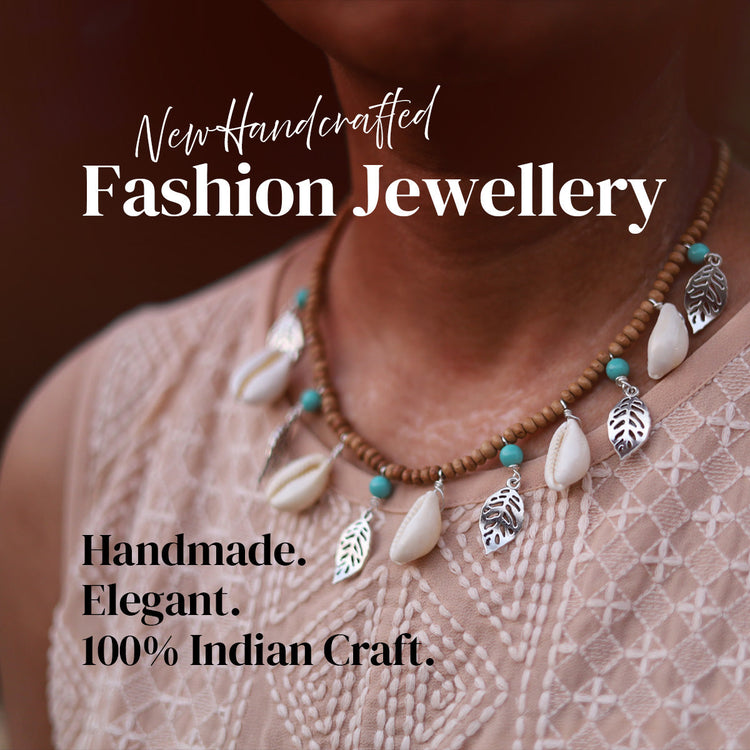 Necklace with leaf and shell pendants on a patterned garment, with text about new handcrafted jewellery of fashion jewellery for women by India Handicraftz