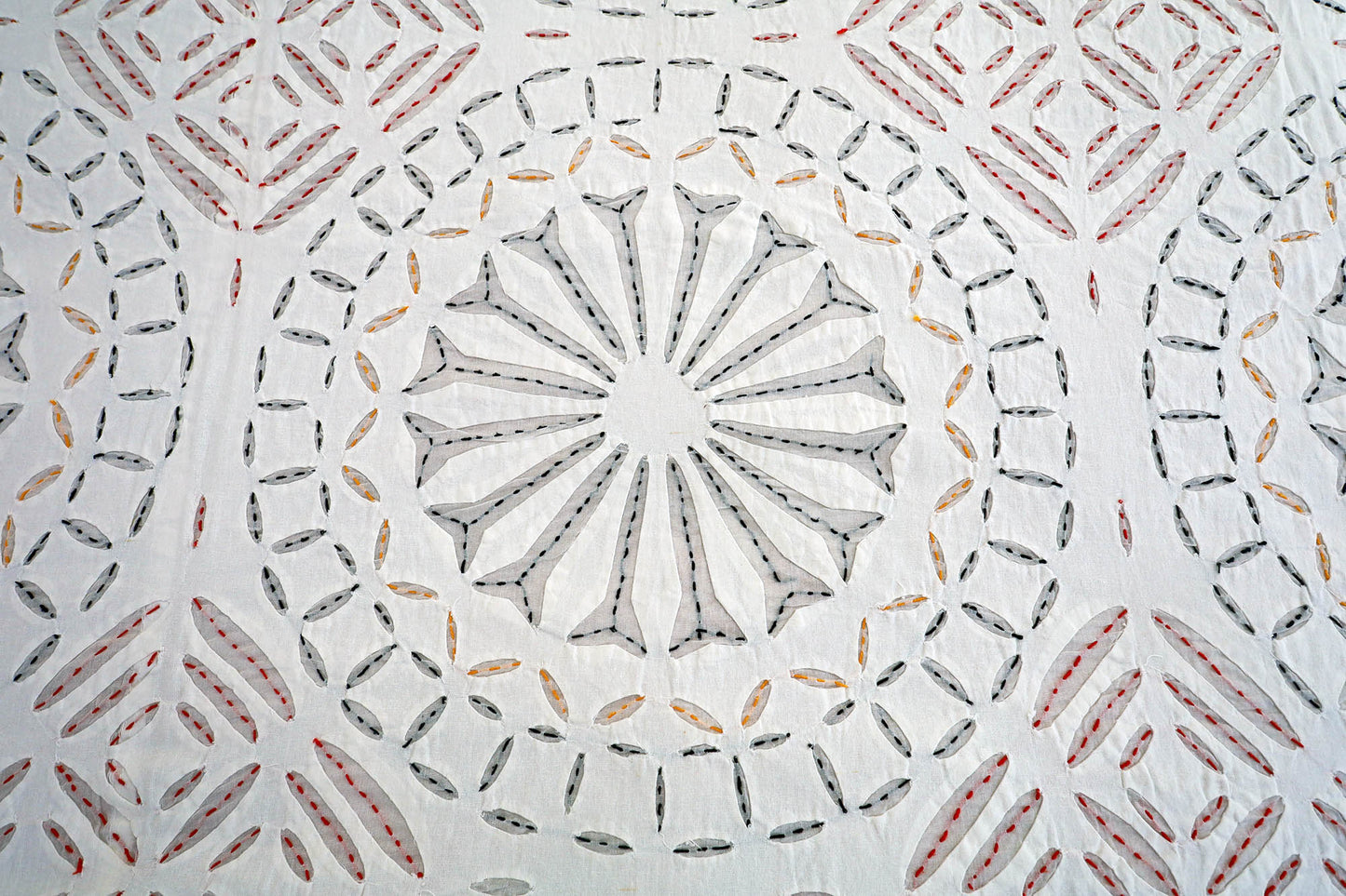 Applique cutwork detail on handcrafted cotton bed cover