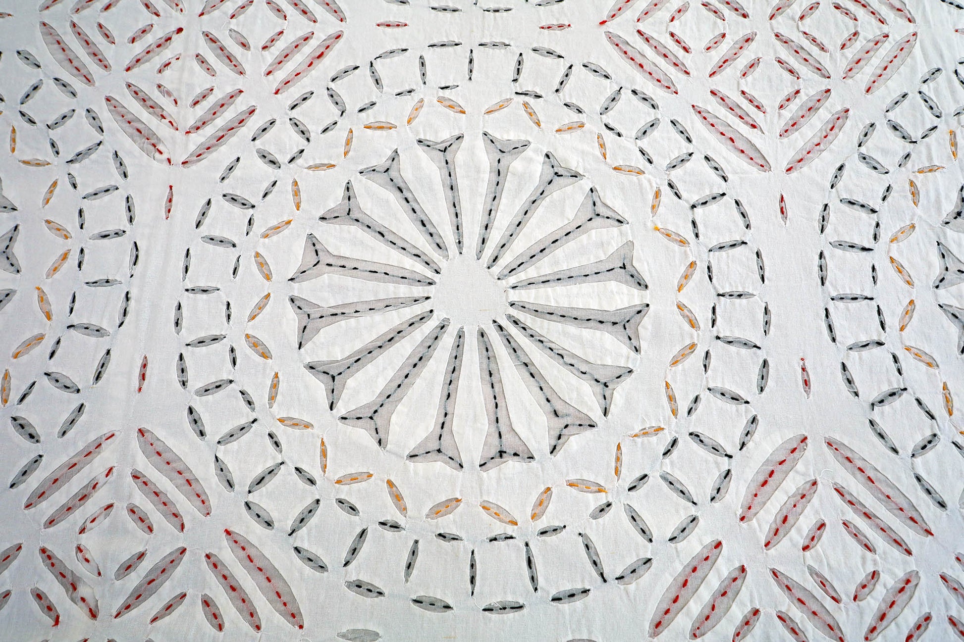 Applique cutwork detail on handcrafted cotton bed cover