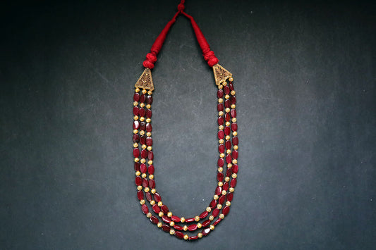 Full view of 3 layered golden balls & oval glass beaded necklace on a dark background – women fashion jewellery