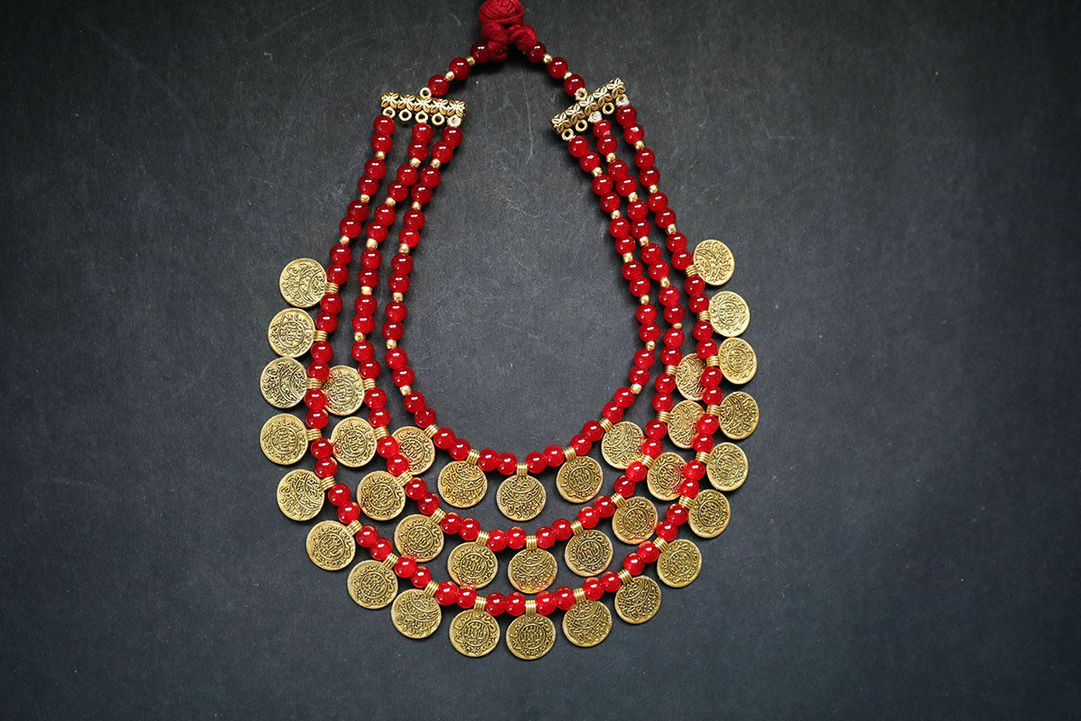 Full view of 3 layered golden ginni and glass beaded long necklace on a dark background – women fashion jewellery