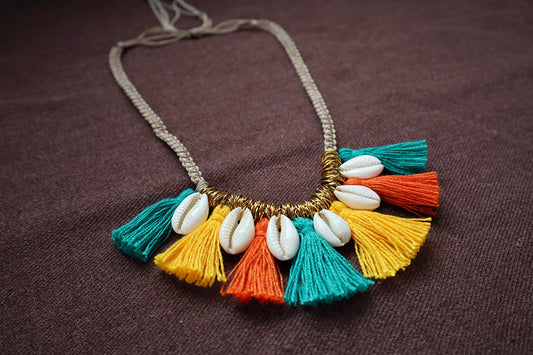 Perspective view of short tassel and cowrie multicolored necklace – fashion jewellery for women