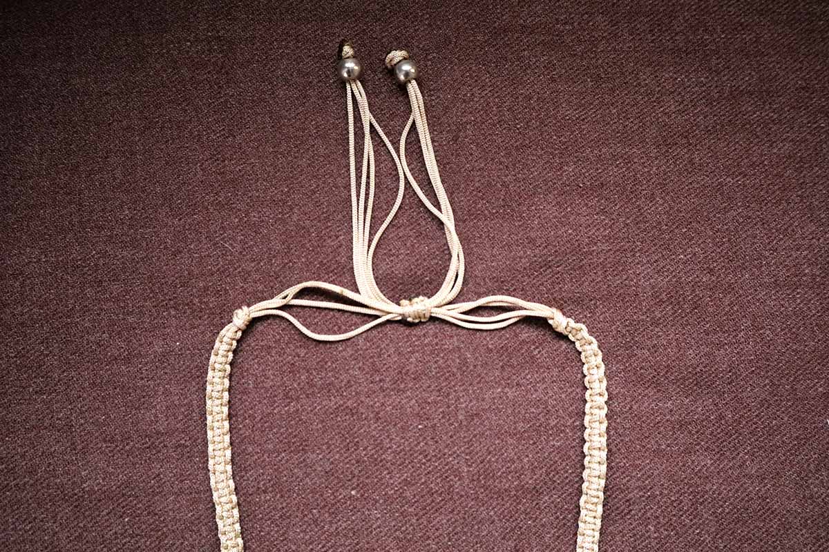 Showing the knot structure of handwoven tassel and cowrie multicolored short necklace – fashion jewellery for women