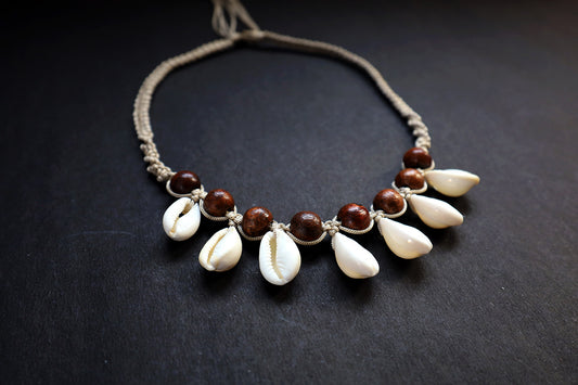 Perspective view of hemp weaved short necklace with wooden beads and cowrie – fashion jewellery for women