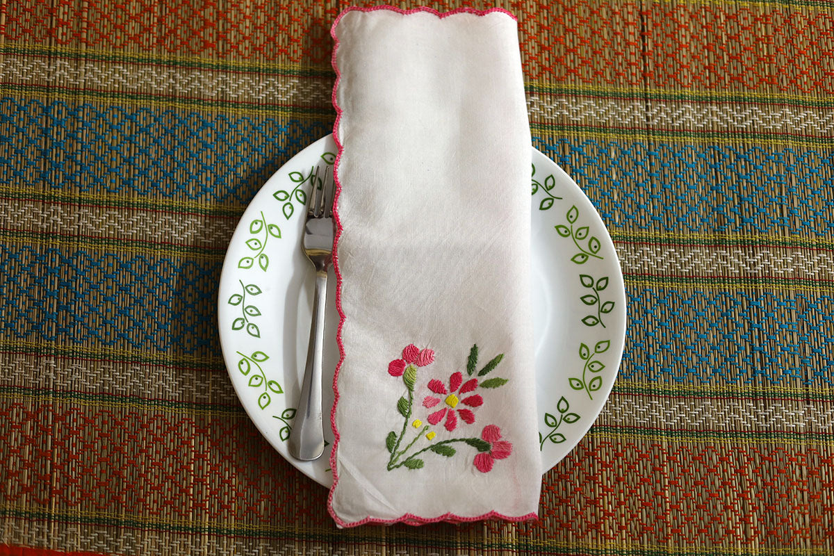 Pink Hand Embroidery Napkins, Set of 4 folded, displaying fine pink embroidery with green accents on soft cotton