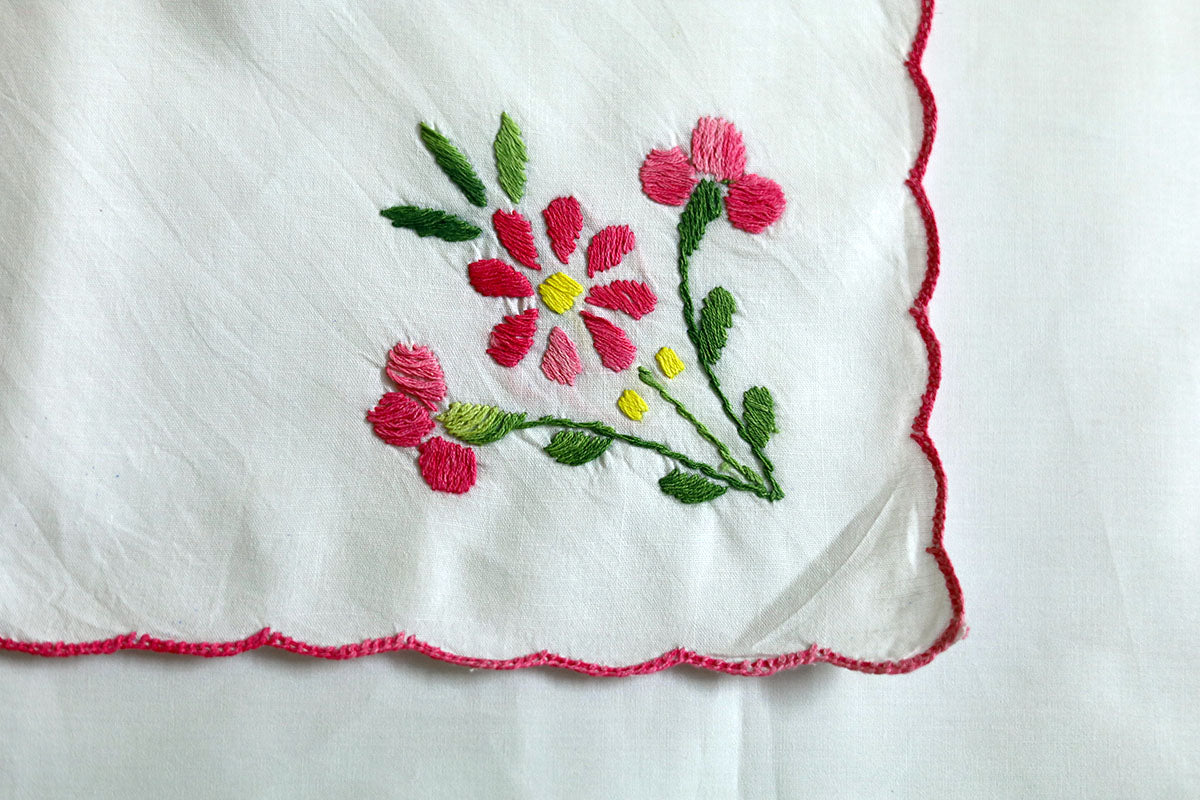 Close-up of detailed pink and green embroidery on Pink Hand Embroidery Napkins, showcasing the fine craftsmanship