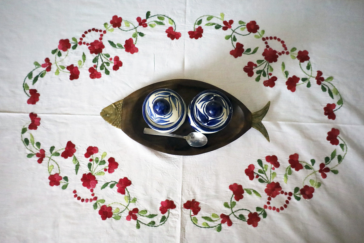 Top view of Maroon Hand Embroidery Table Cloth’s embroidery designs on a chest of drawers.